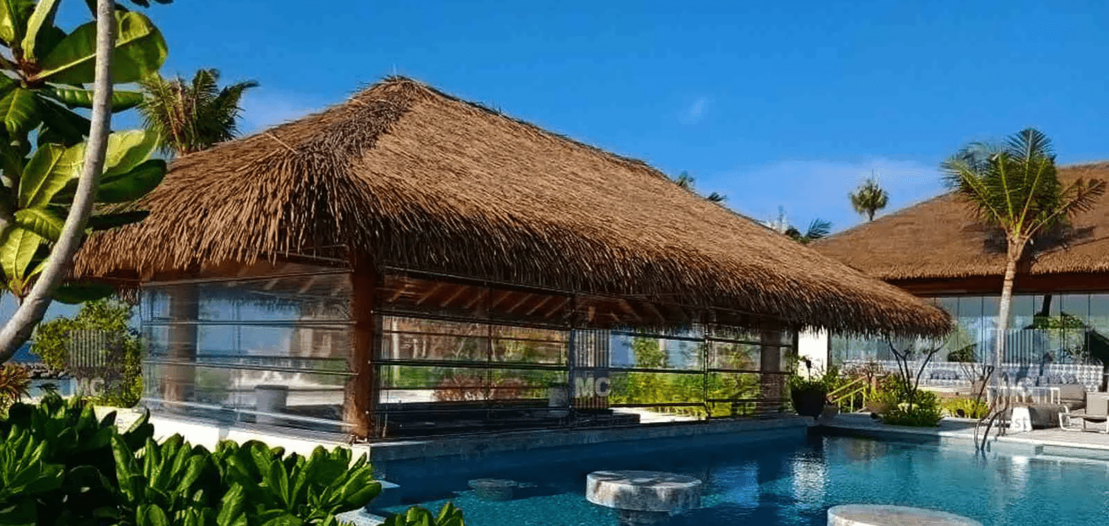 Monsoon blinds under a thatch roof